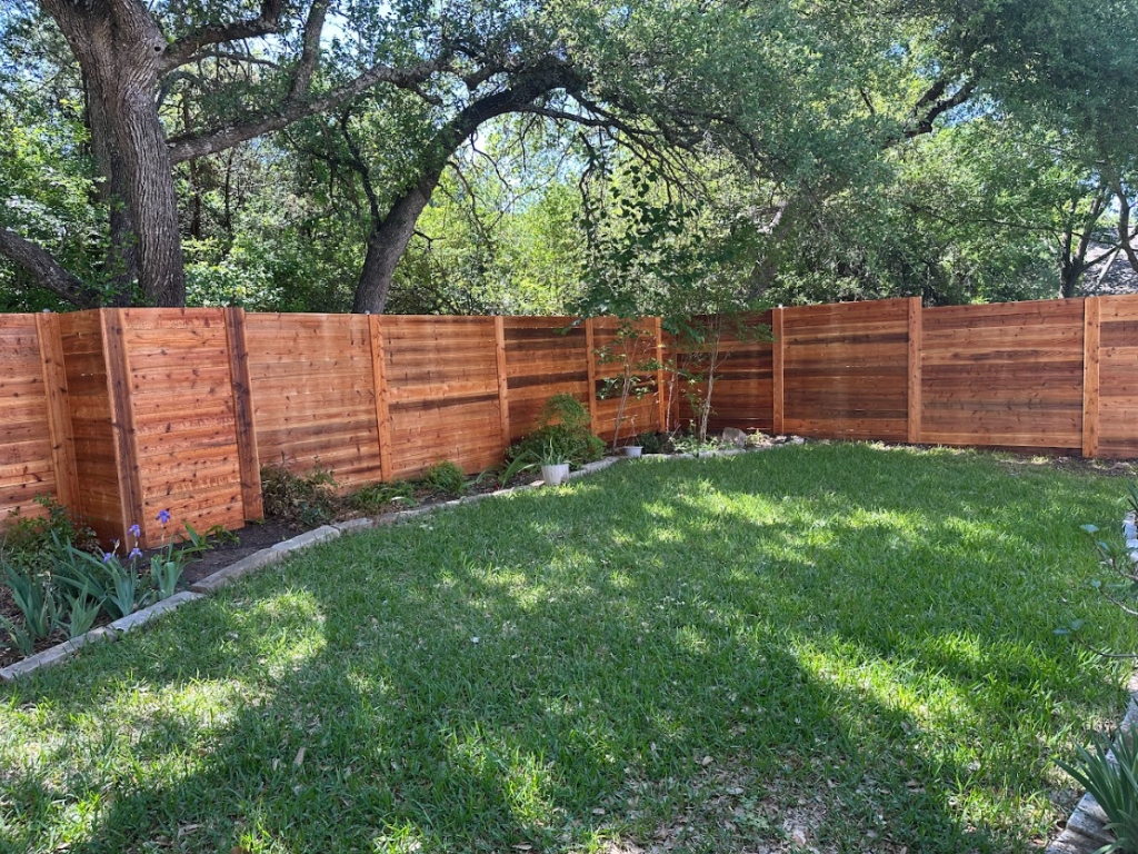 Horizontal cedar privacy fence with garden